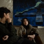 Natalia Kaliada and Daniella Kaliada pose with Sergey Grinevich’s work in progress "Official. unofficial. Belarus."