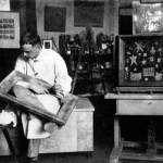 Black and white photo of an artist in his studio.