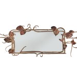 Mirror with gold leaf on the frame.