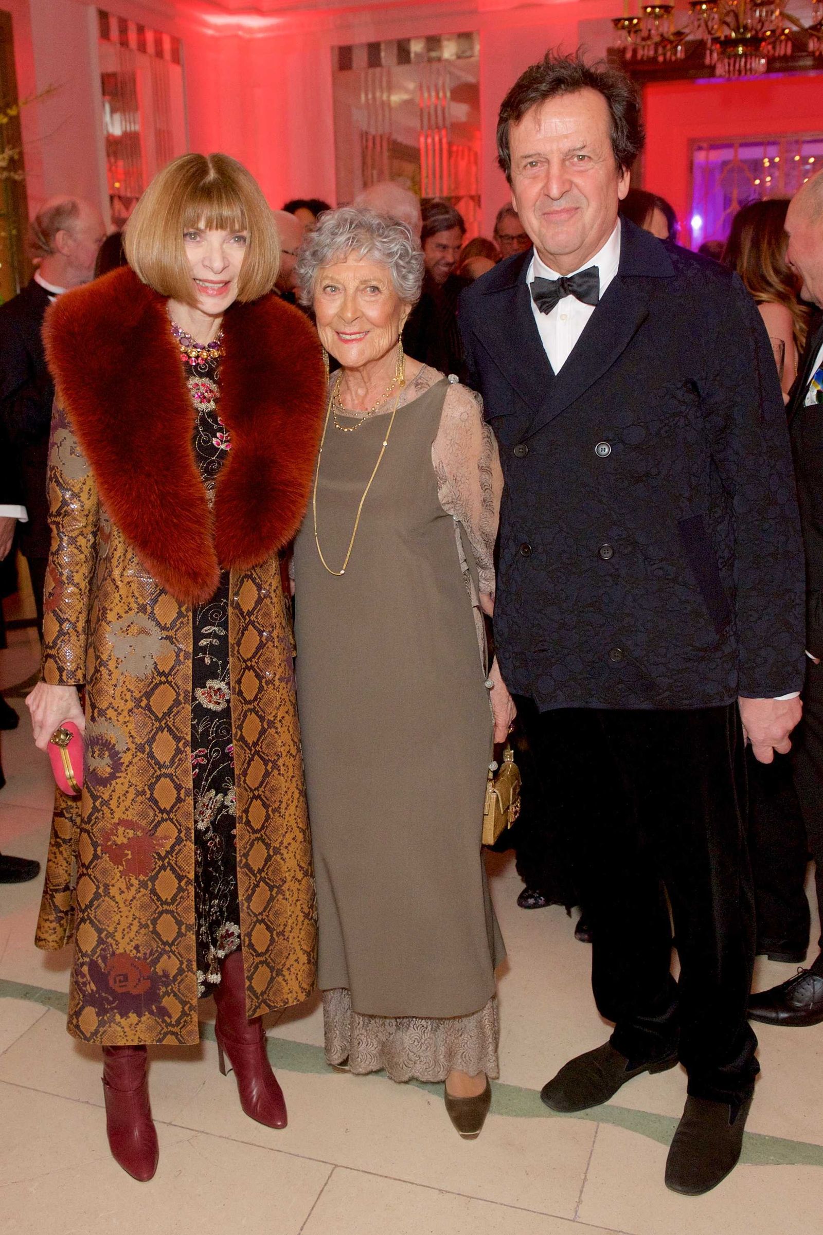 Image may contain Abner Mikva Anna Wintour characters clothing coats adult accessories formal wear ties and jewelry