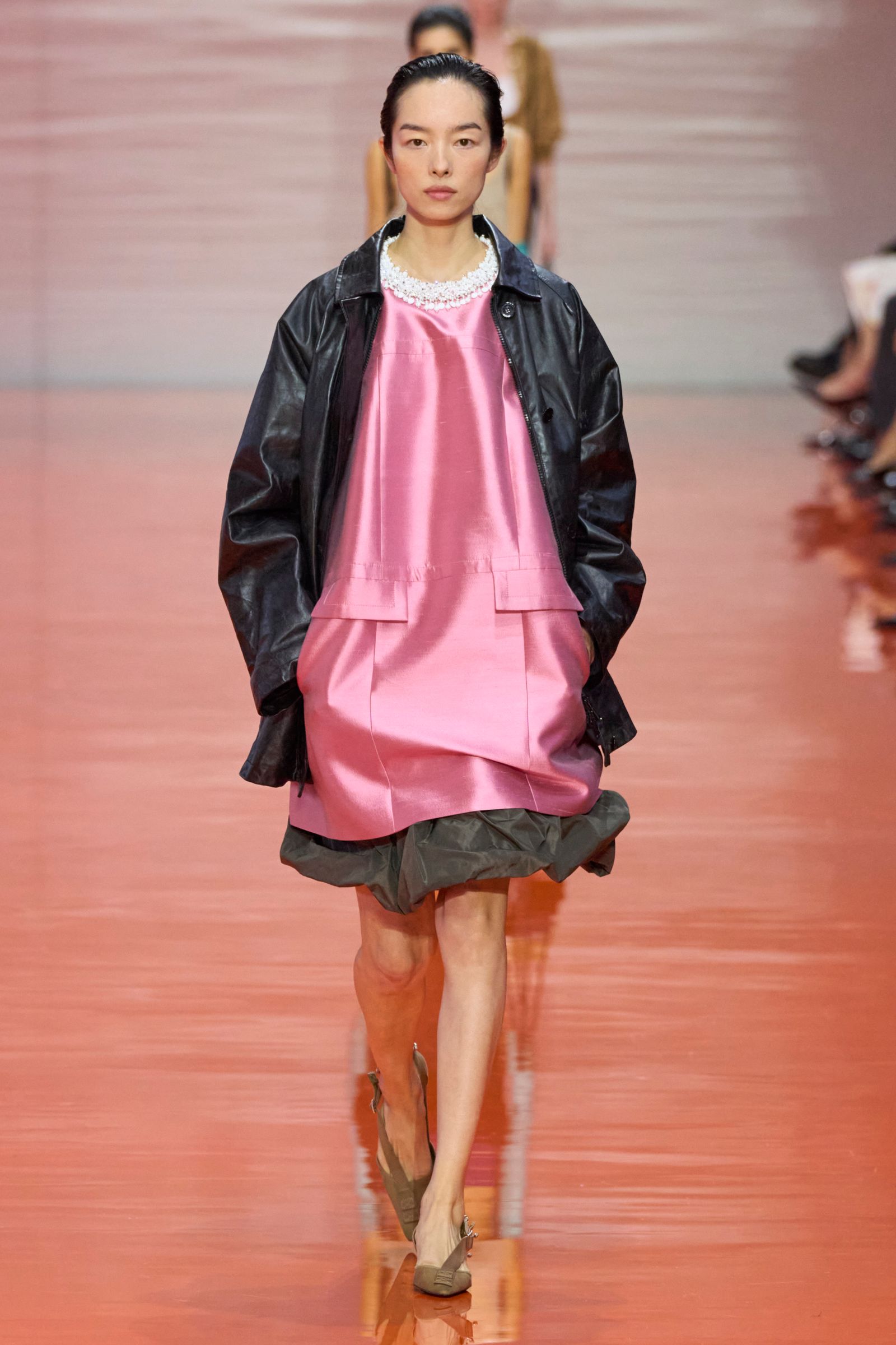 Selena wears a pink Prada dress at the Spring 2026 show.