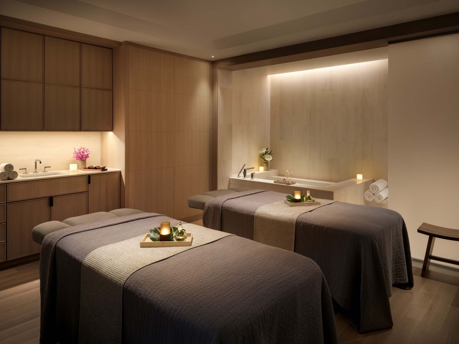 Image may contain bed, furniture, spa interior design, candle sink and sink faucet