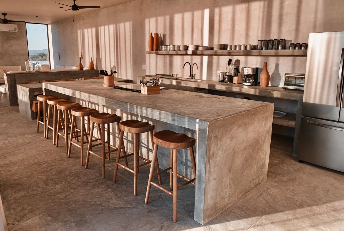 Pictures may contain interior interior design kitchen kitchen island bar stools furniture and plants