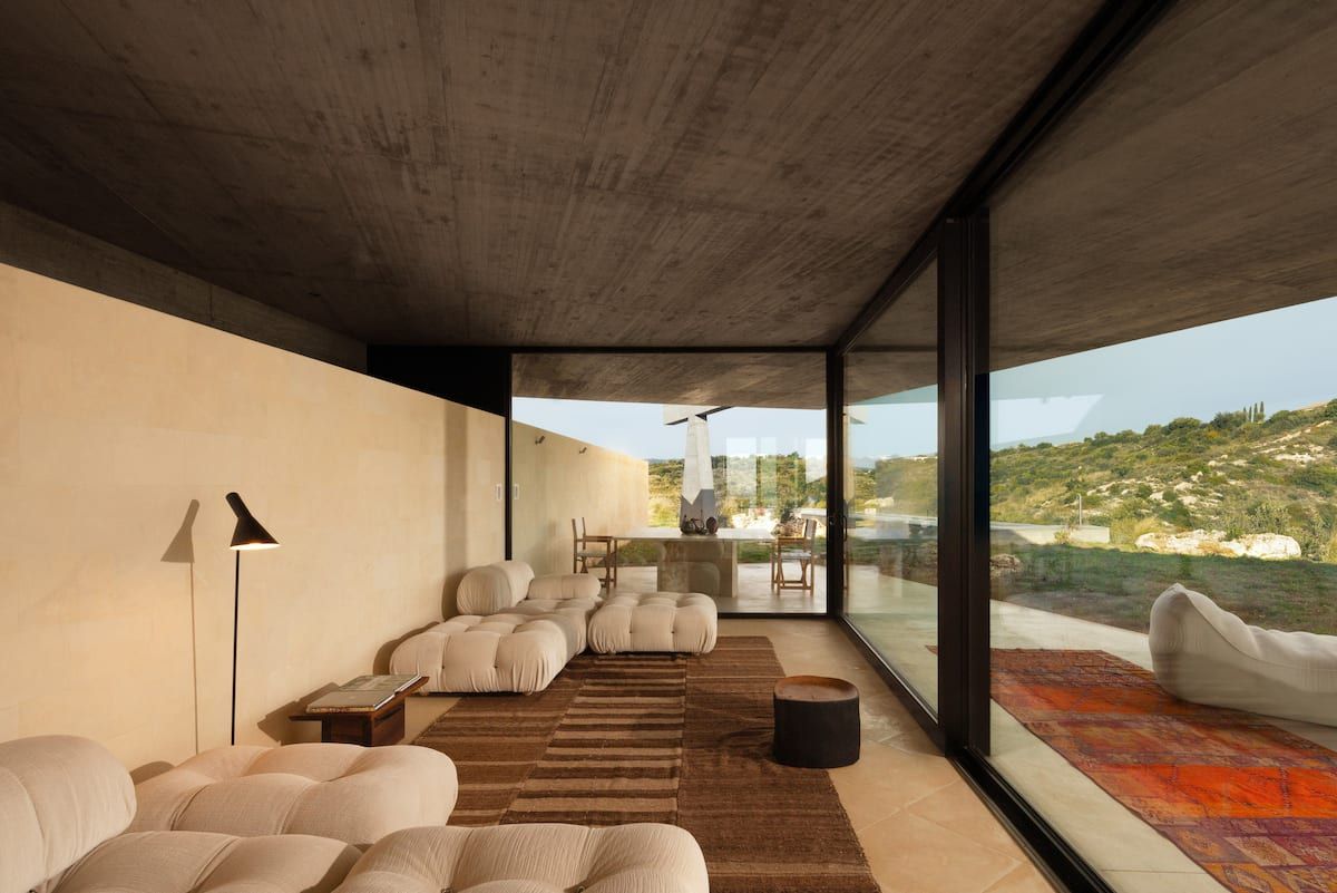 The image may contain interior interior design home decoration architecture architecture furniture living room room and sofa