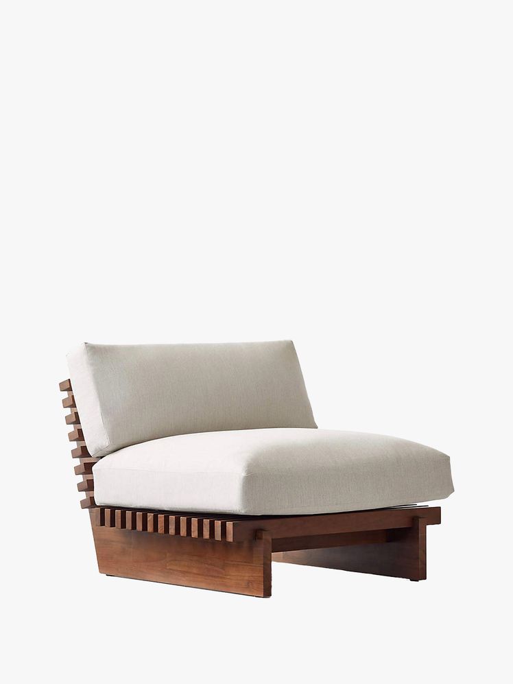 Image may contain: furniture, cushions, home decor and chair