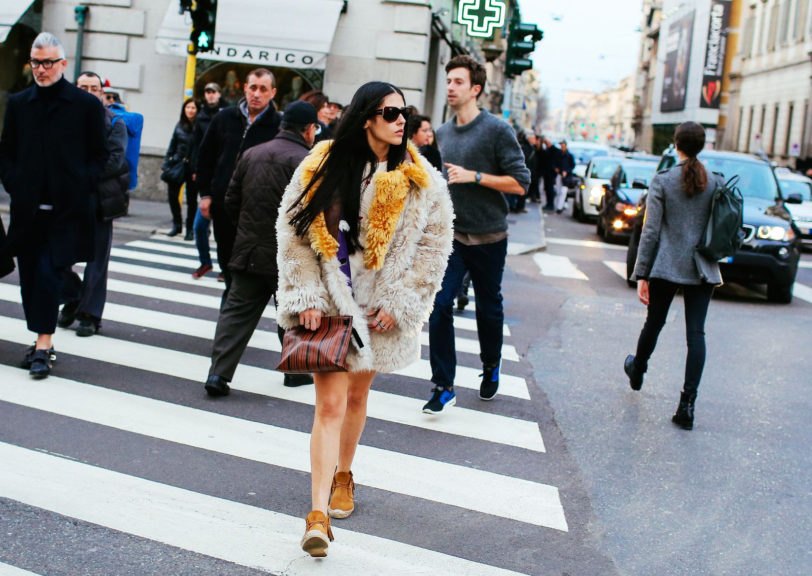 Image may contain asphalt tarmac, people, pedestrians, clothing, shoes, footwear, clothing and zebra crossing