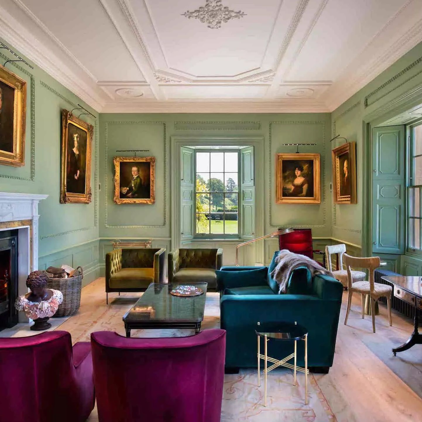 Image may contain home decoration art painting, sofa, furniture, chair, interior, adult, table and architecture