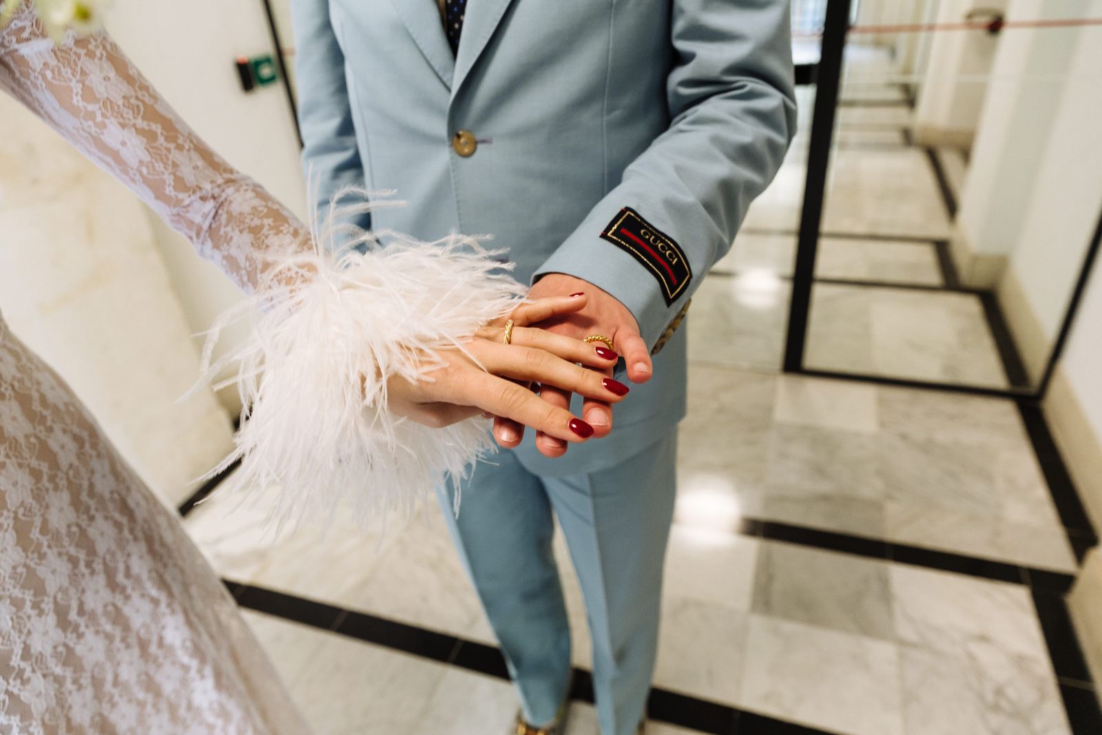 Image may contain blazers, coats, body parts, fingers, hands, cuffs, adult formal wear and suits