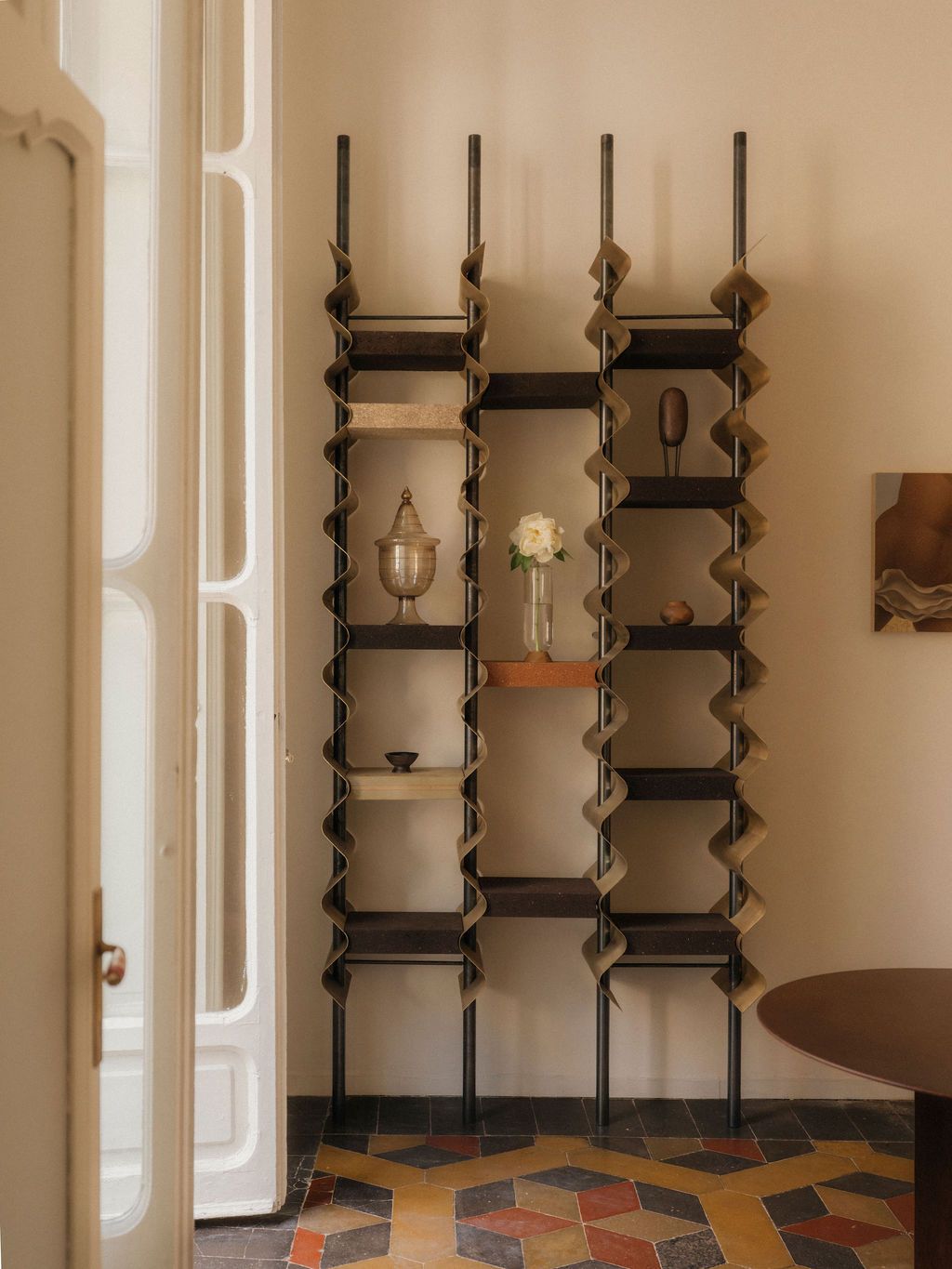 Image may contain furniture, bookcases and people