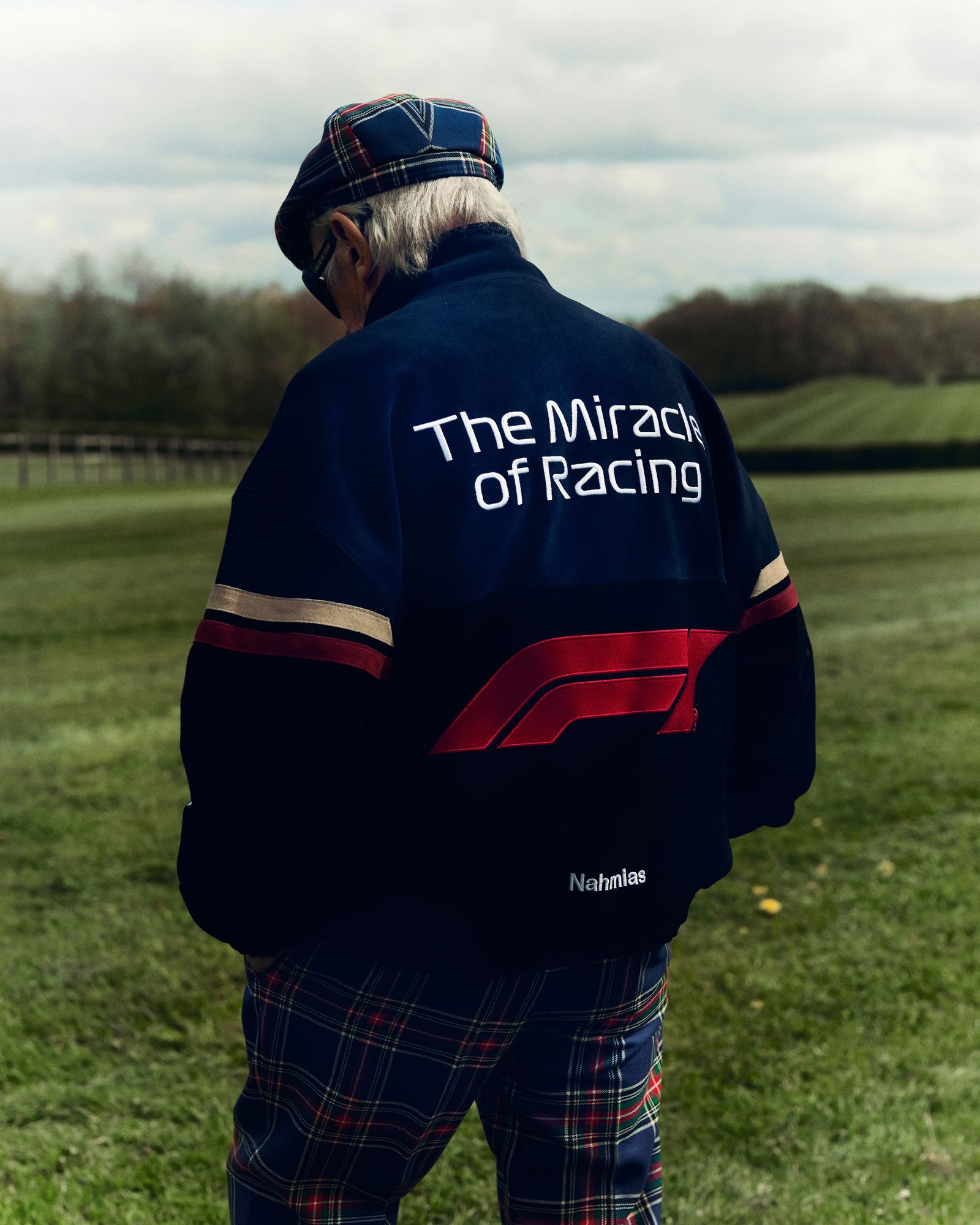 Pictures may contain grass, plants, clothing, coats, jackets, adult baseball caps, hats and hats