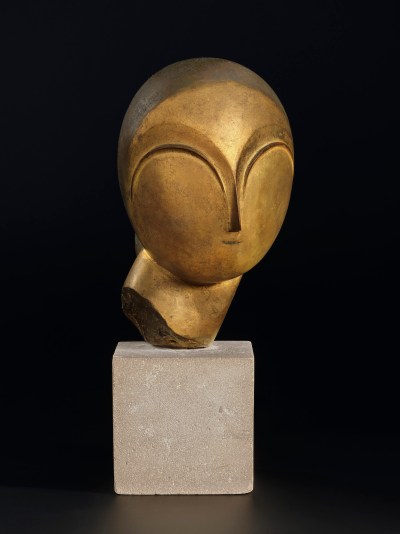 A sculpture of an abstracted head on a pedestal.