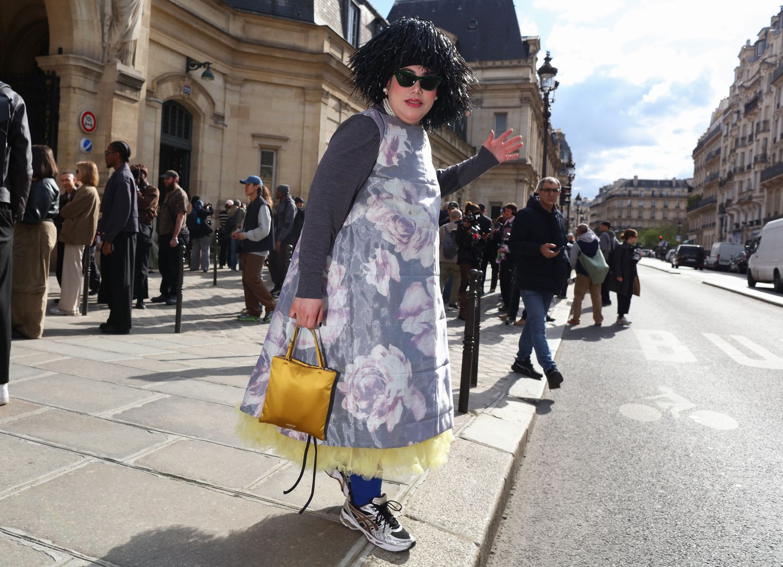 Image may contain accessories sunglasses bag handbag adult clothing footwear city roads and streets