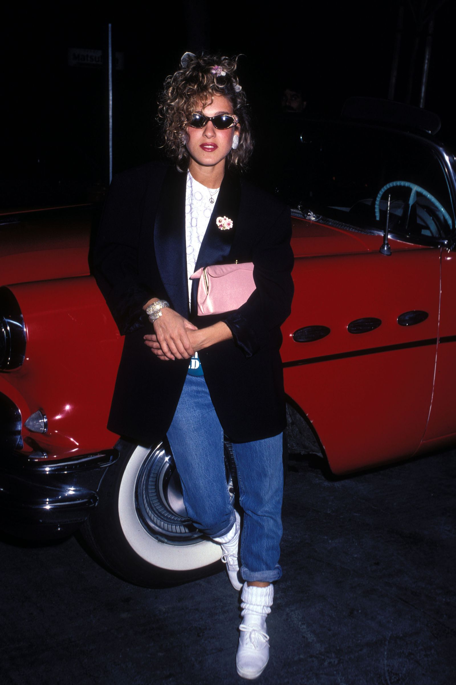 Images may contain Sarah Jessica Parker clothing, coats, jackets, pants, blazers, faces, heads, people photography and portraits