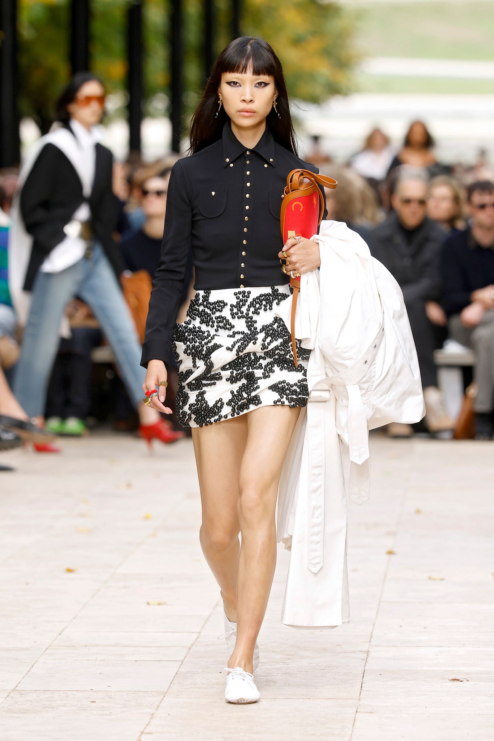 Image may contain Kate Beaton clothing skirt adult shorts pedestrian miniskirt black hair and hair