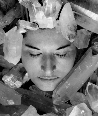 Marina Abramović's face is surrounded by crystals.