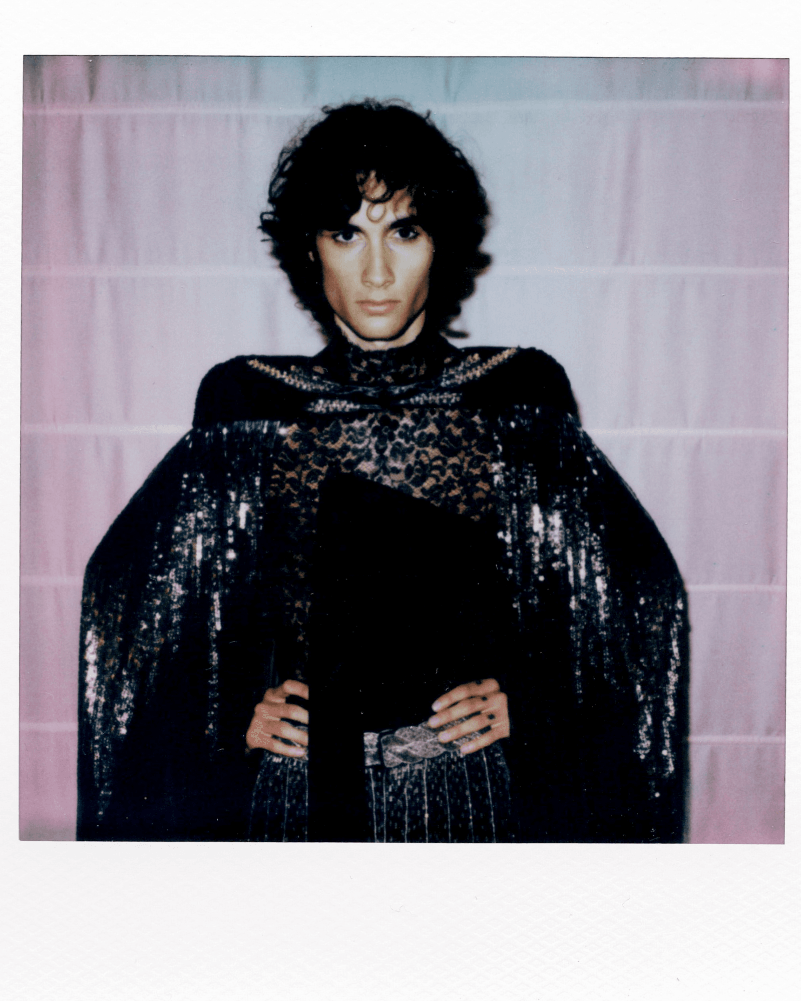 Image may contain fashionable adult capes, cloaks, faces and heads