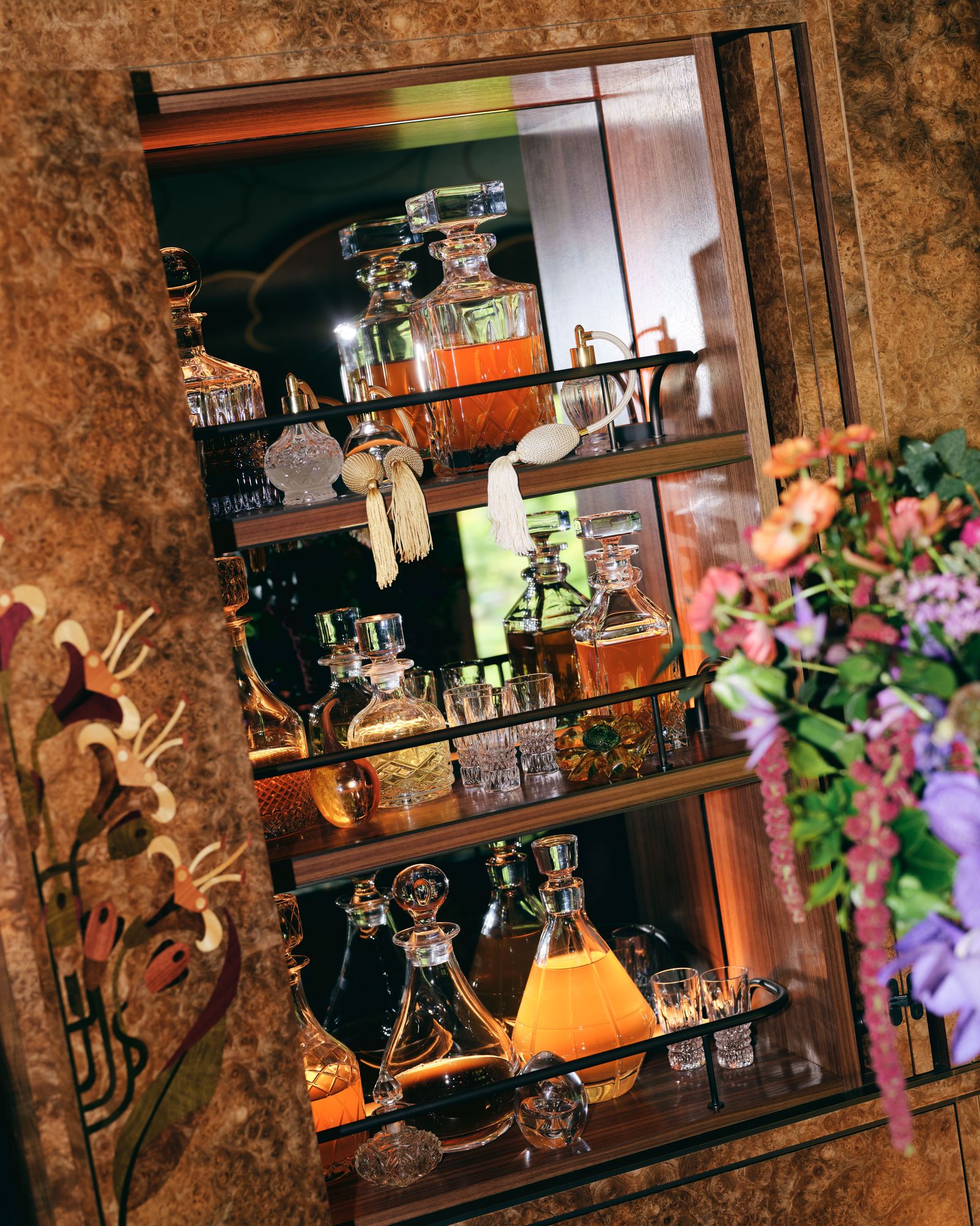 Image may contain bottles, cosmetics, perfume cabinets, furniture and bars