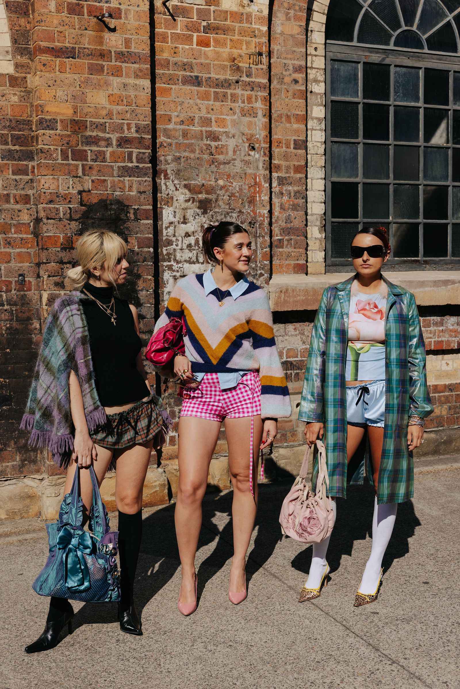 Image may contain clothing, shorts, accessories, bags, handbags, footwear, high heels, shoes, teenagers and glasses