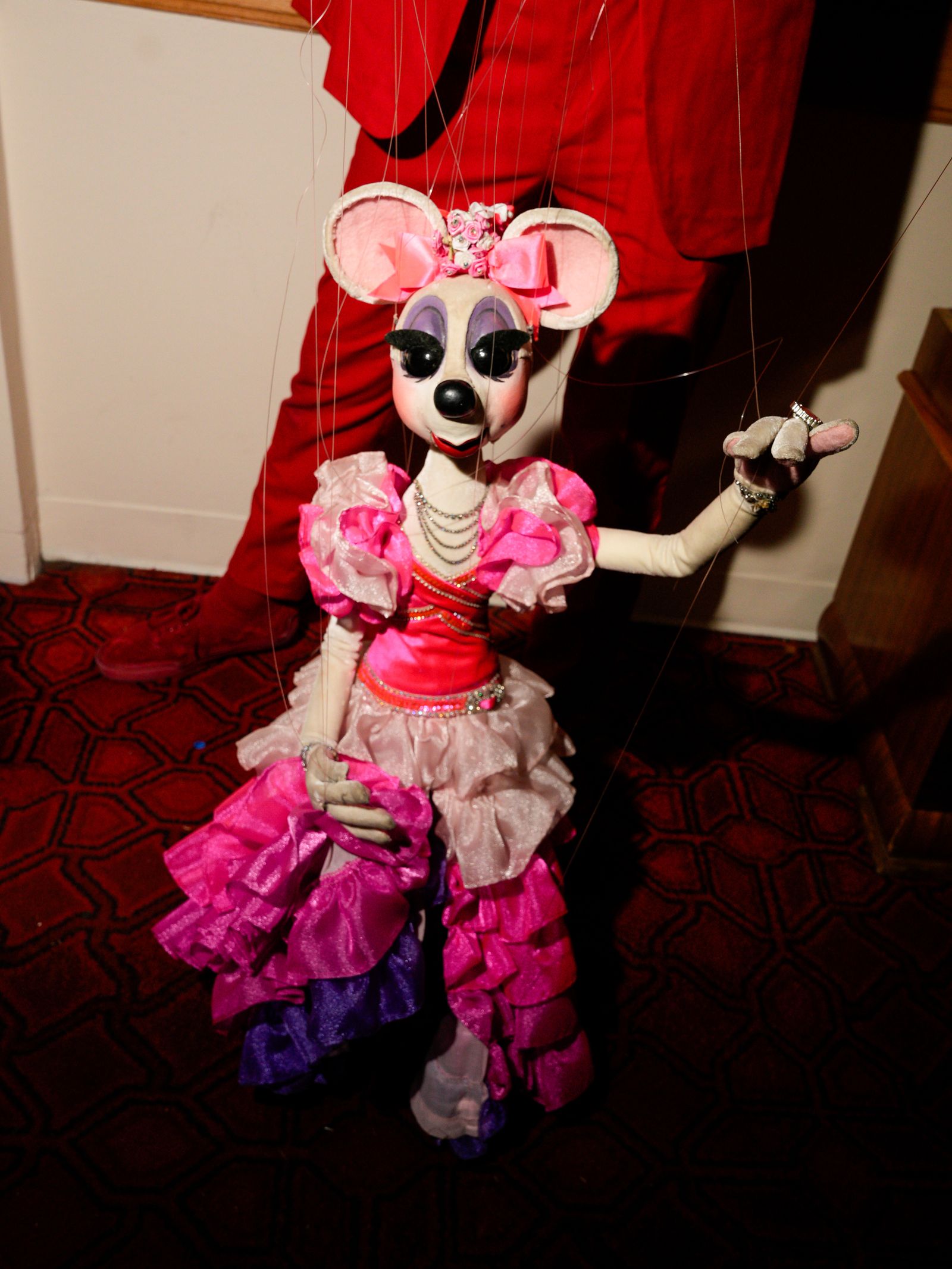 Image may contain clothing, clothing, people, adults, wedding, toys, dresses, dolls, purple face, head photography and portraits