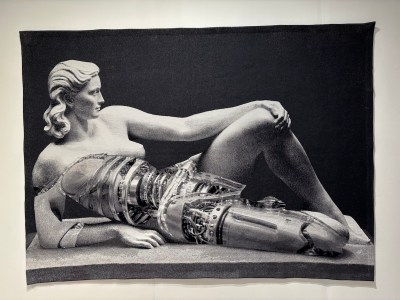 One woven work shows a nude woman with her breasts and part of one leg removed to reveal machinery.