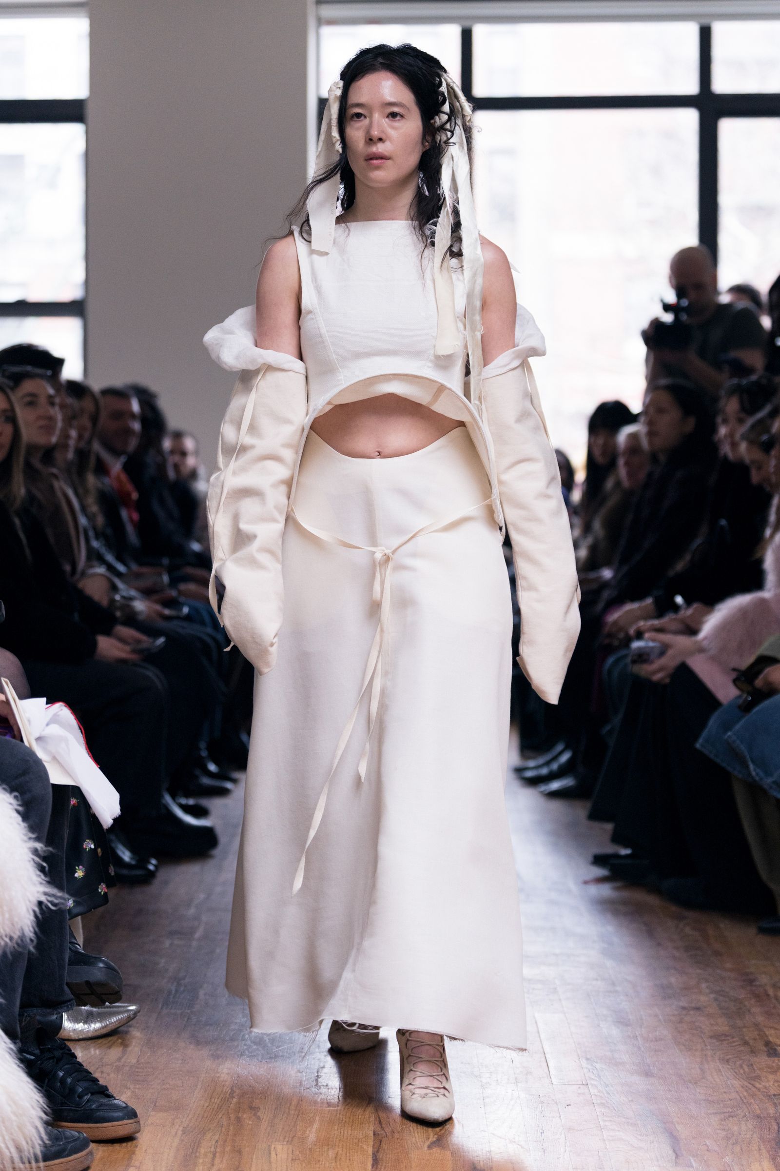 Image may contain Penelope Skinner Francisco Ferrer Adult Fashion Cape Costume Cameras and Electronics