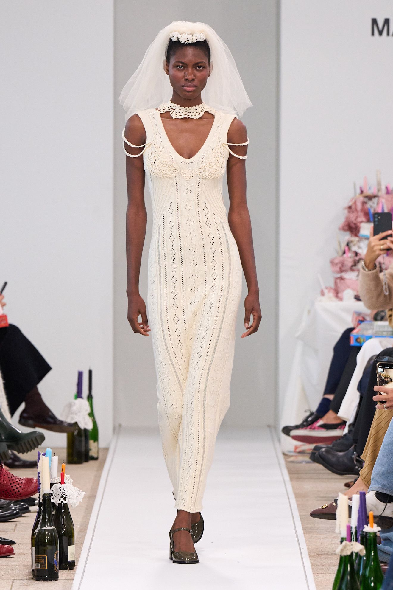 Image may contain clothing, dress, fashion, formal, wedding, wedding dress, sleeves, adults and people