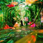 Colorful immersive installation showing green plants and flowers with a person standing in the room