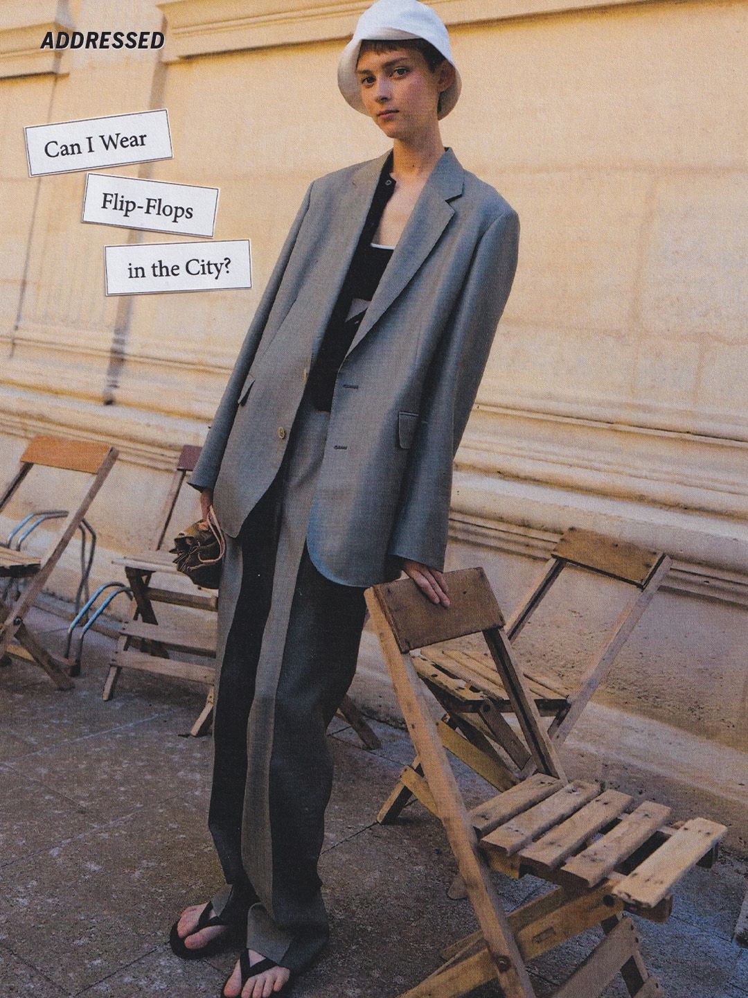 Image may contain clothing, coats, blazers, formal suits, adult coats, chairs, furniture and footwear