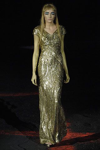 Image may contain clothing, gowns, robes, fashionable evening gowns, people and dresses