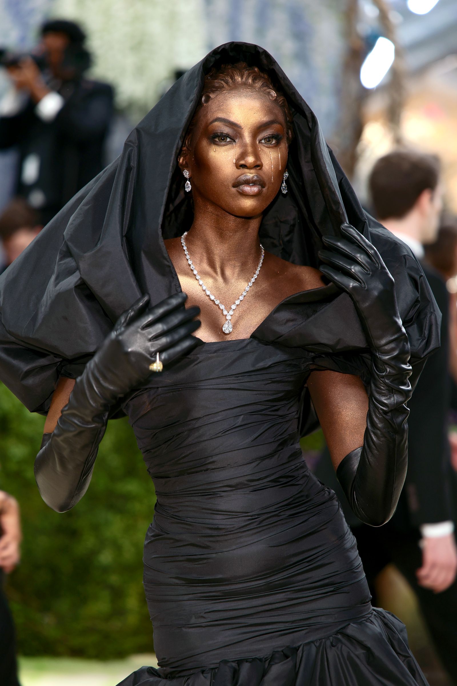 Images may contain fashion clothing, gloves, faces, heads, people photography, portraits, adult accessories and jewelry