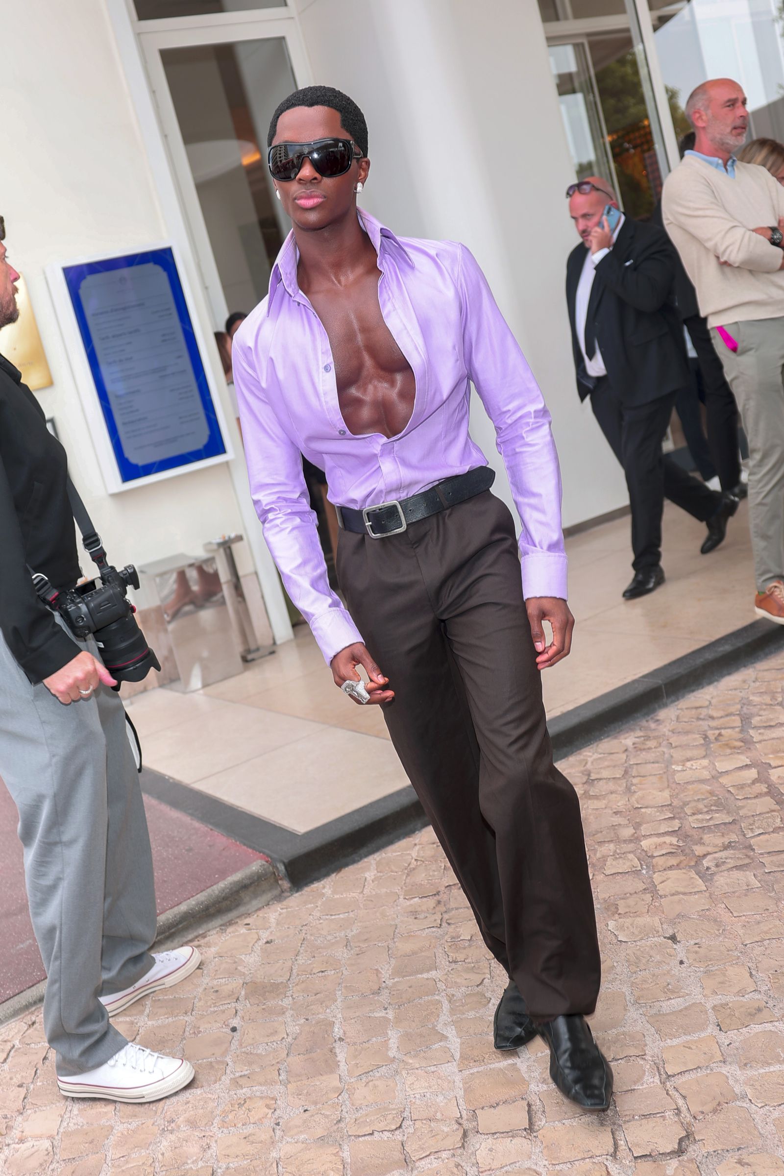 Image may contain Claudio Bunster clothing, pants, accessories, sunglasses, formal wear, shirts, adults and blazers