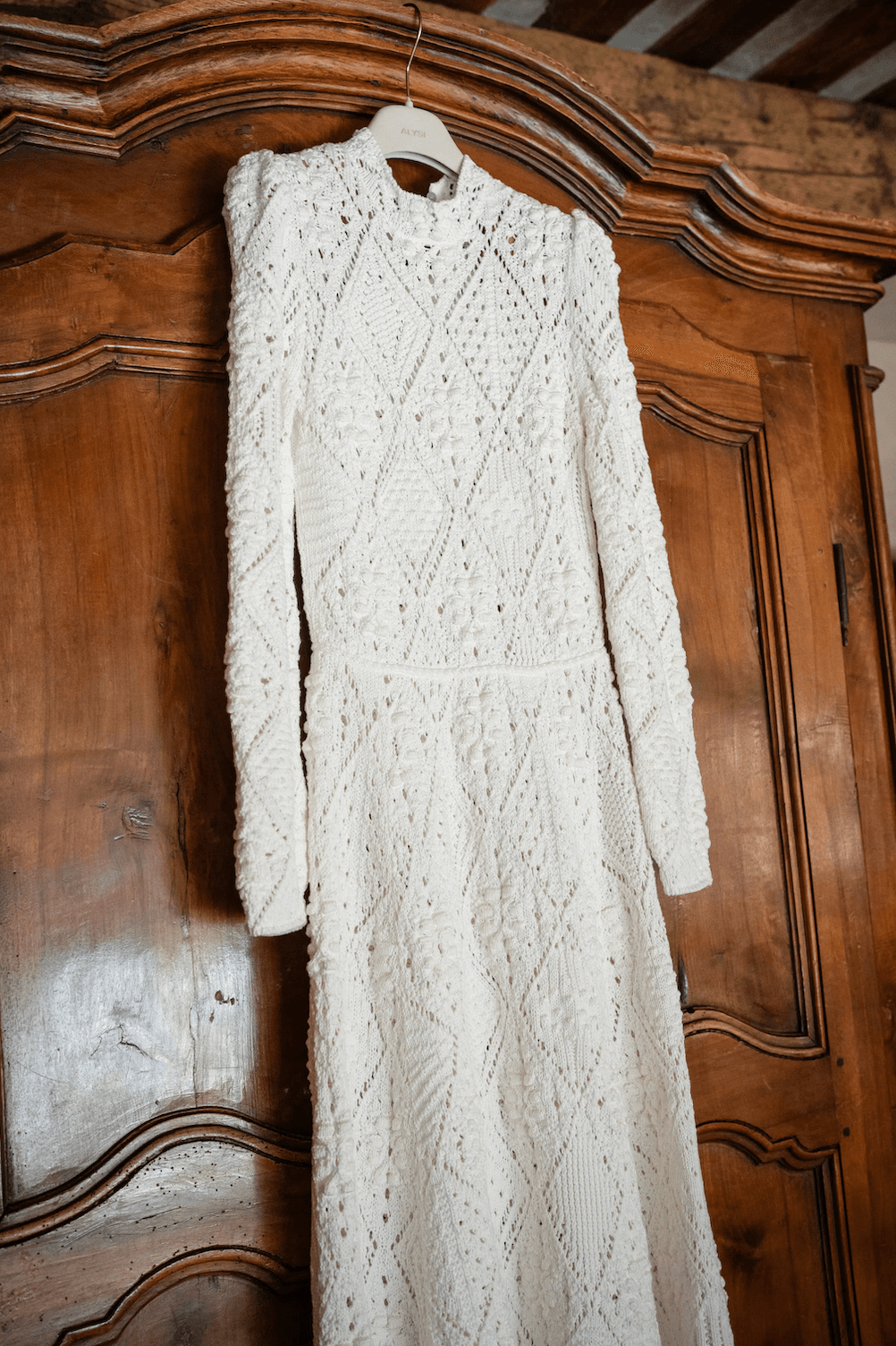 Image may contain clothing: long sleeves, sleeves, knitwear, sweaters and dresses