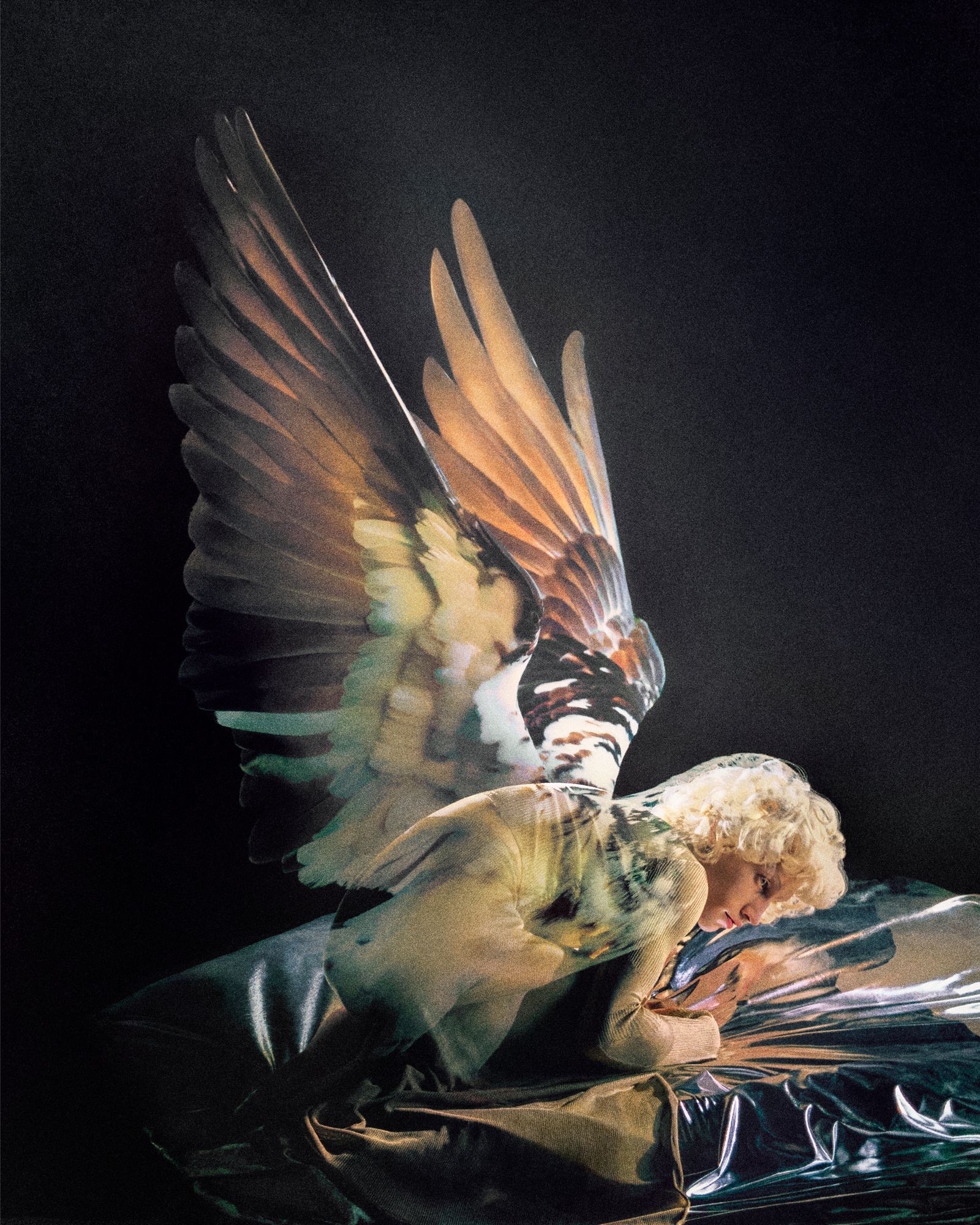 Image may contain angel face and head