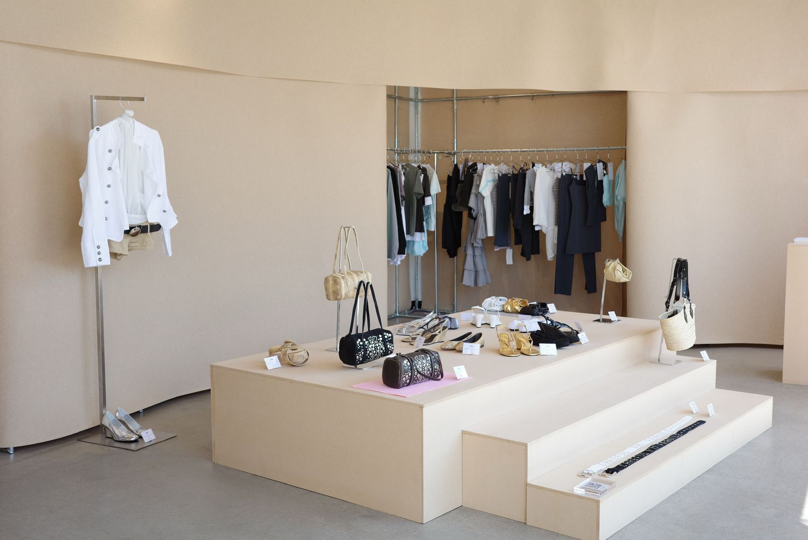 Image may contain dressing room, interior, room accessories, bag, handbag, furniture, store, clothing, shoes