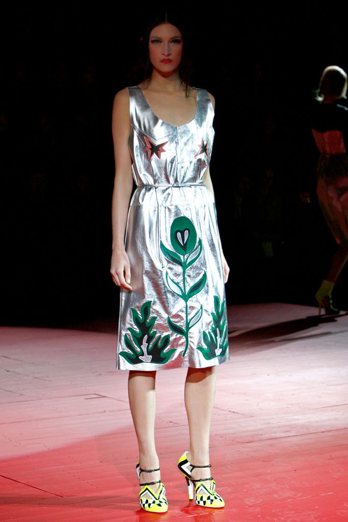 Image may contain clothing, gowns, gowns, fashionable evening gowns, people and runway