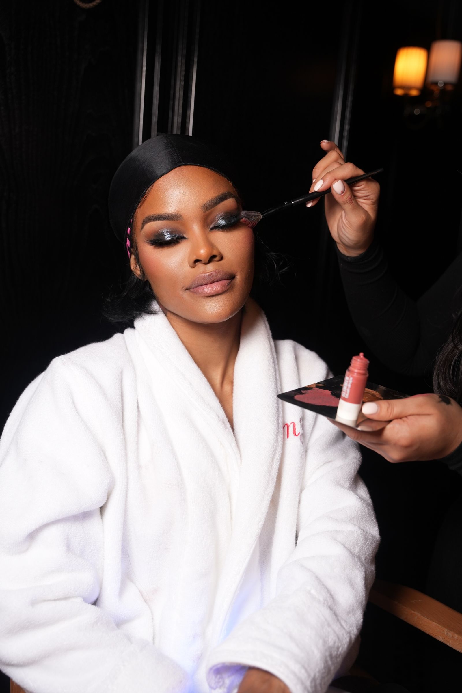 Image may contain Teyana Taylor adult cosmetics cosmetic bottles and perfume