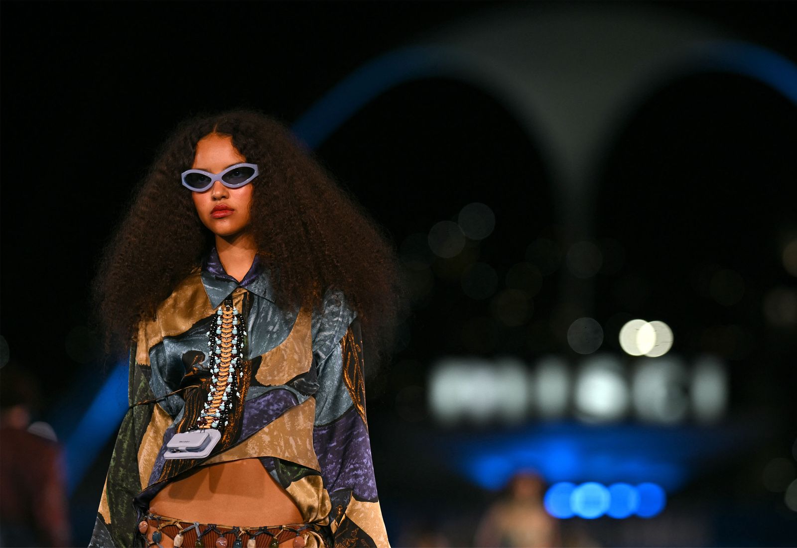 Image may contain fashion adult performer solo performance accessories glasses sunglasses face and head