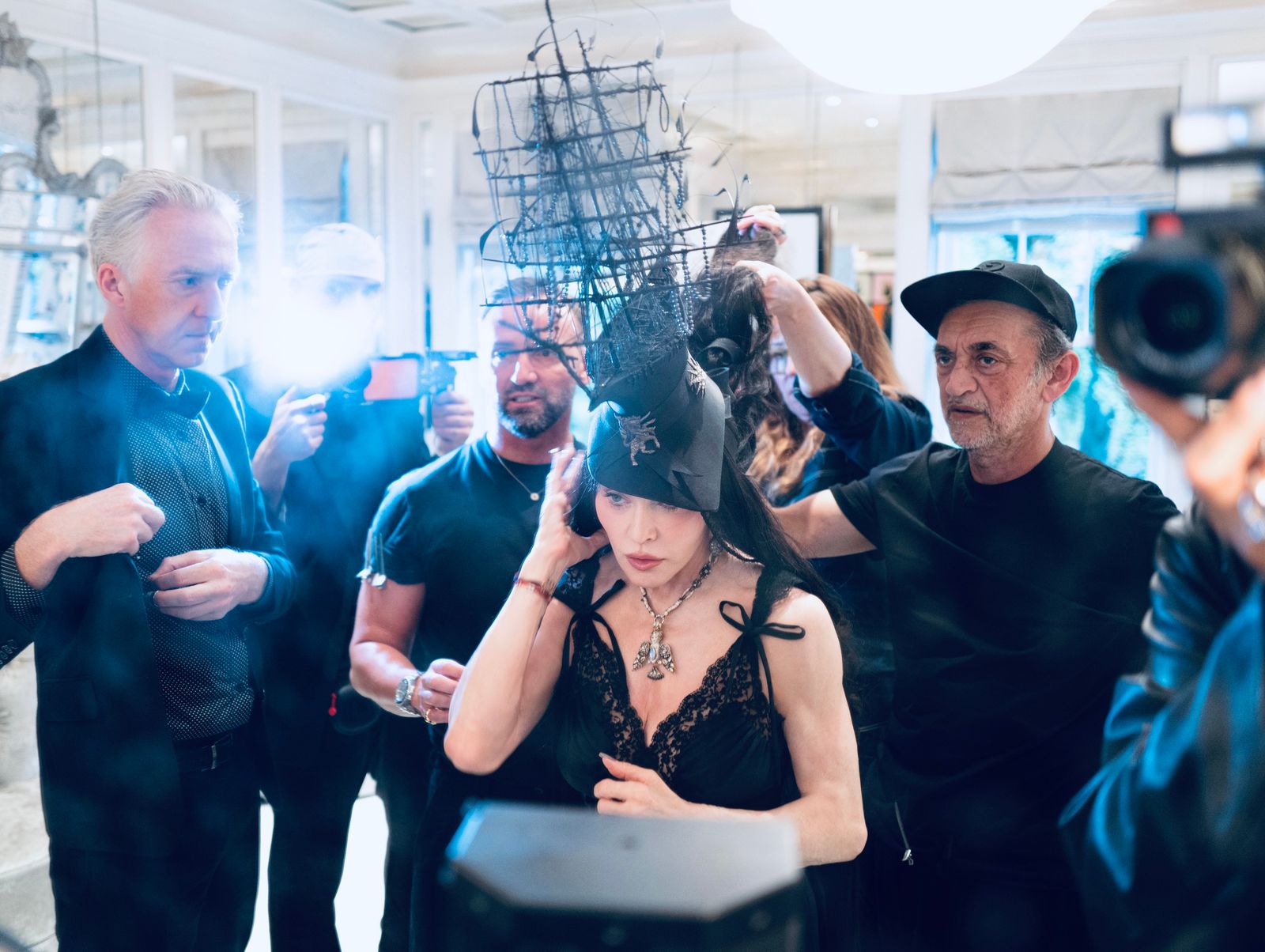 Image may contain Madonna figures, photobombing, adult city wedding, face, head, accessories and jewelry