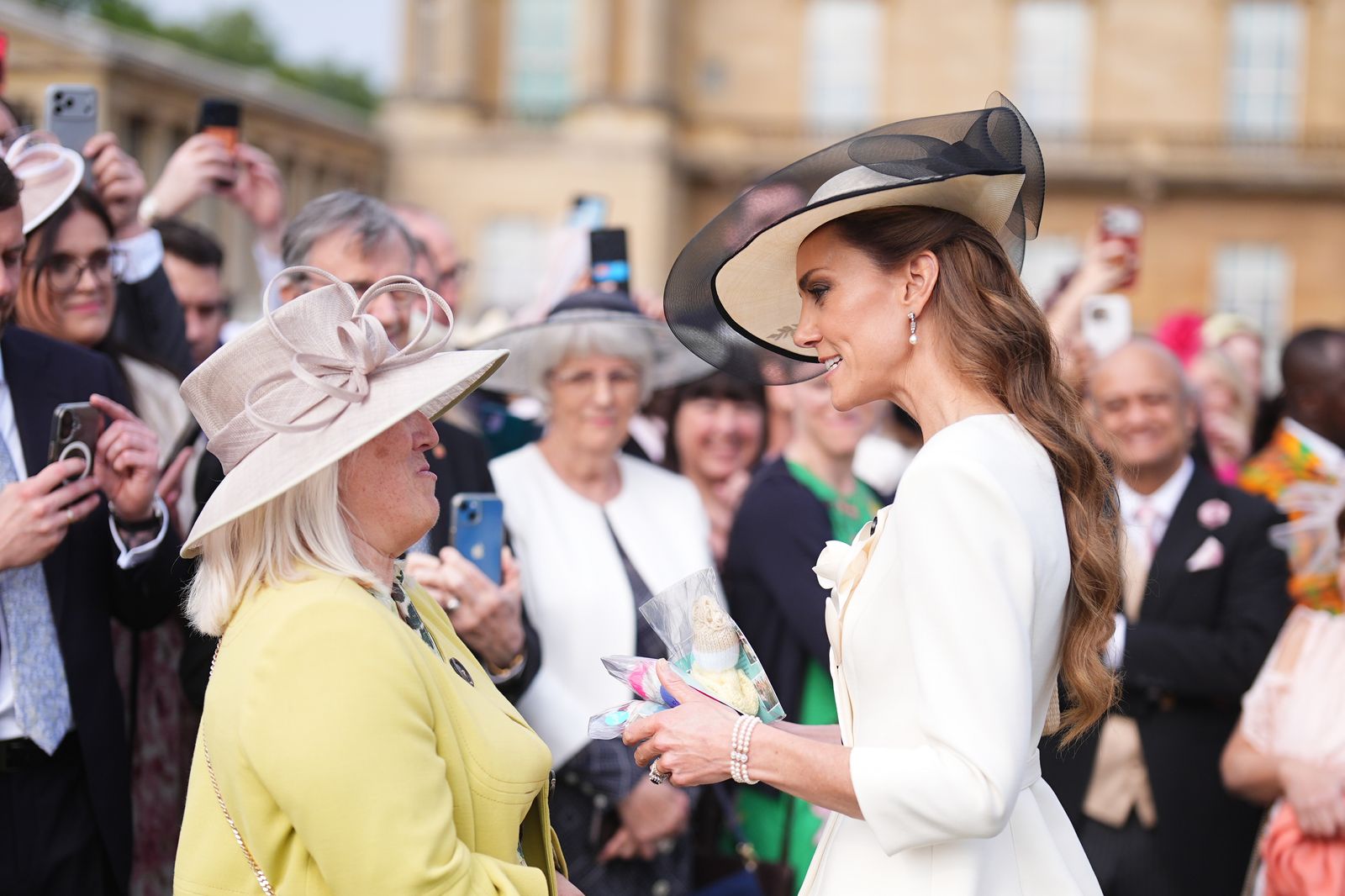 London, England, May 8 Catherine, Princess of Wales, meets guests at the Royal Garden Party at Buckingham Palace on May 8…