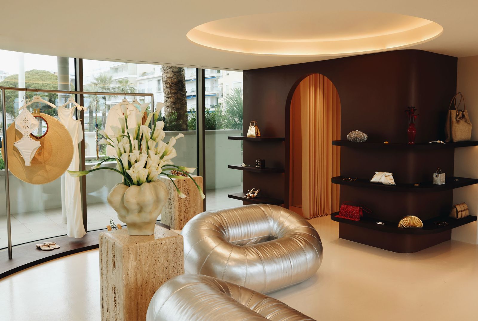 Image may contain cushions home decor furniture architecture building interior living room room and flowers
