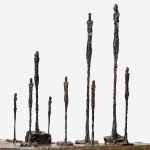 Bronze sculpture shows nine standing elongated figures