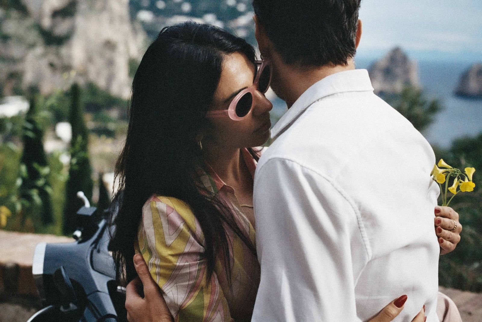 Image may contain accessories, sunglasses, adult faces, heads and romance