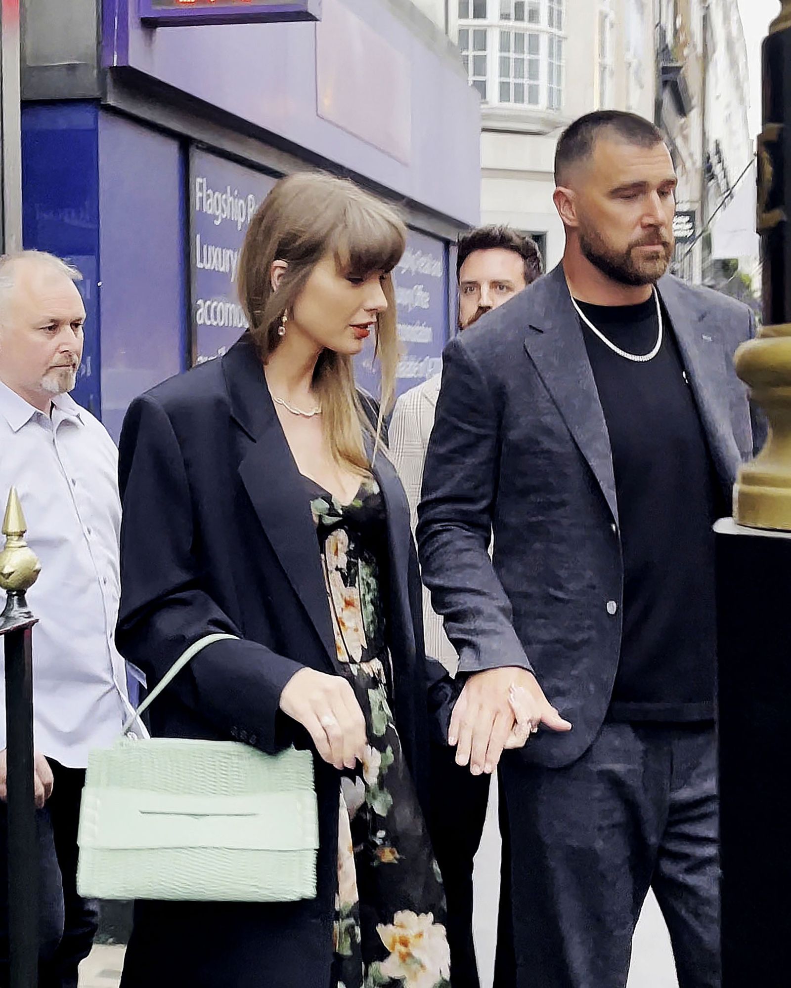 Taylor Swift and boyfriend Travis Kelce pose with British cinematographer Rina Yang as they leave Gymkhana Indian…