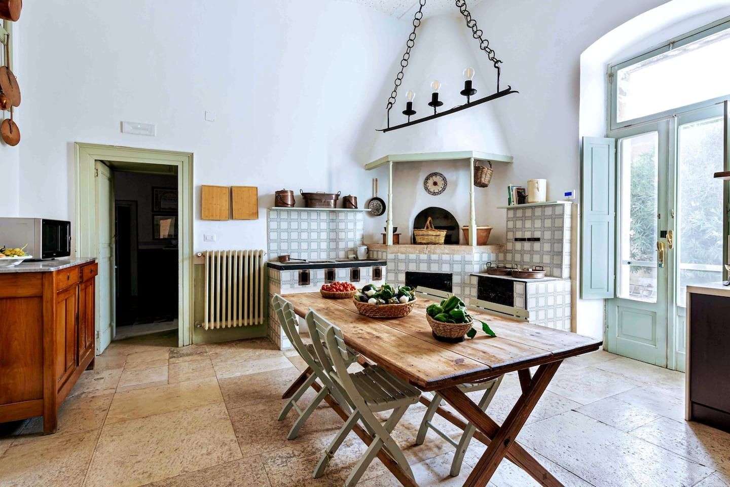 Image may contain interior interior design, furniture, table, architecture, architecture, restaurant, dining table and room