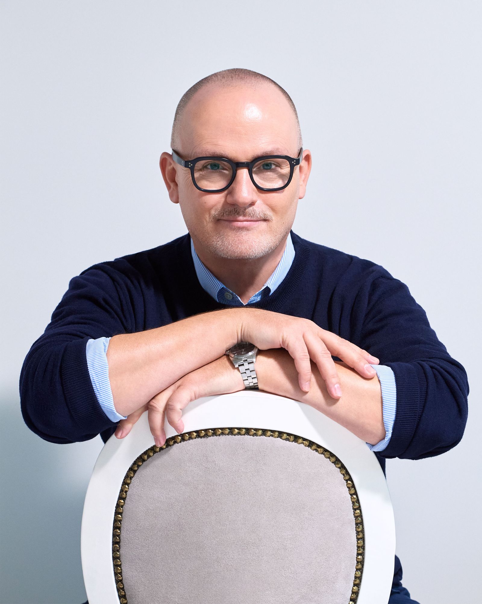 The picture may contain photography, face, head, portrait, accessories, glasses, adult and sitting
