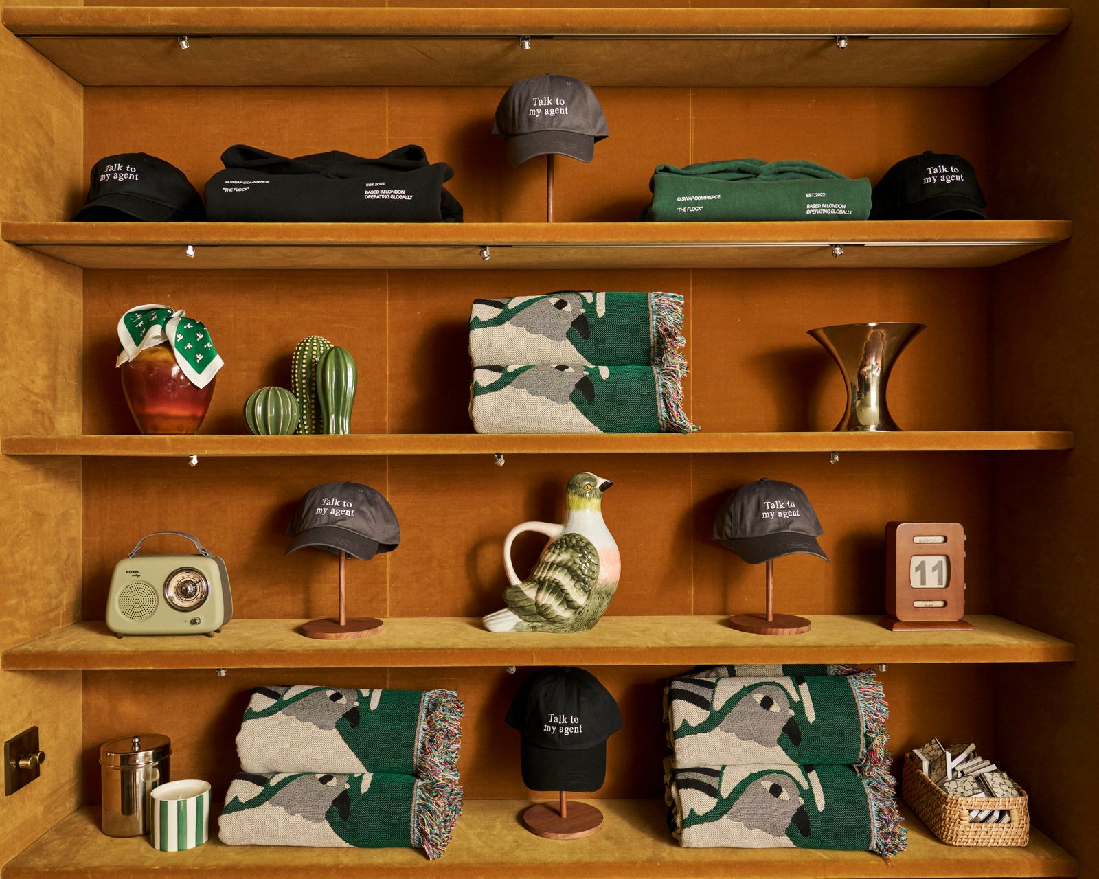 Image may contain baseball caps, hats, clothing, hats, shelves, furniture, wardrobes, cabinets, accessories, bags and totes