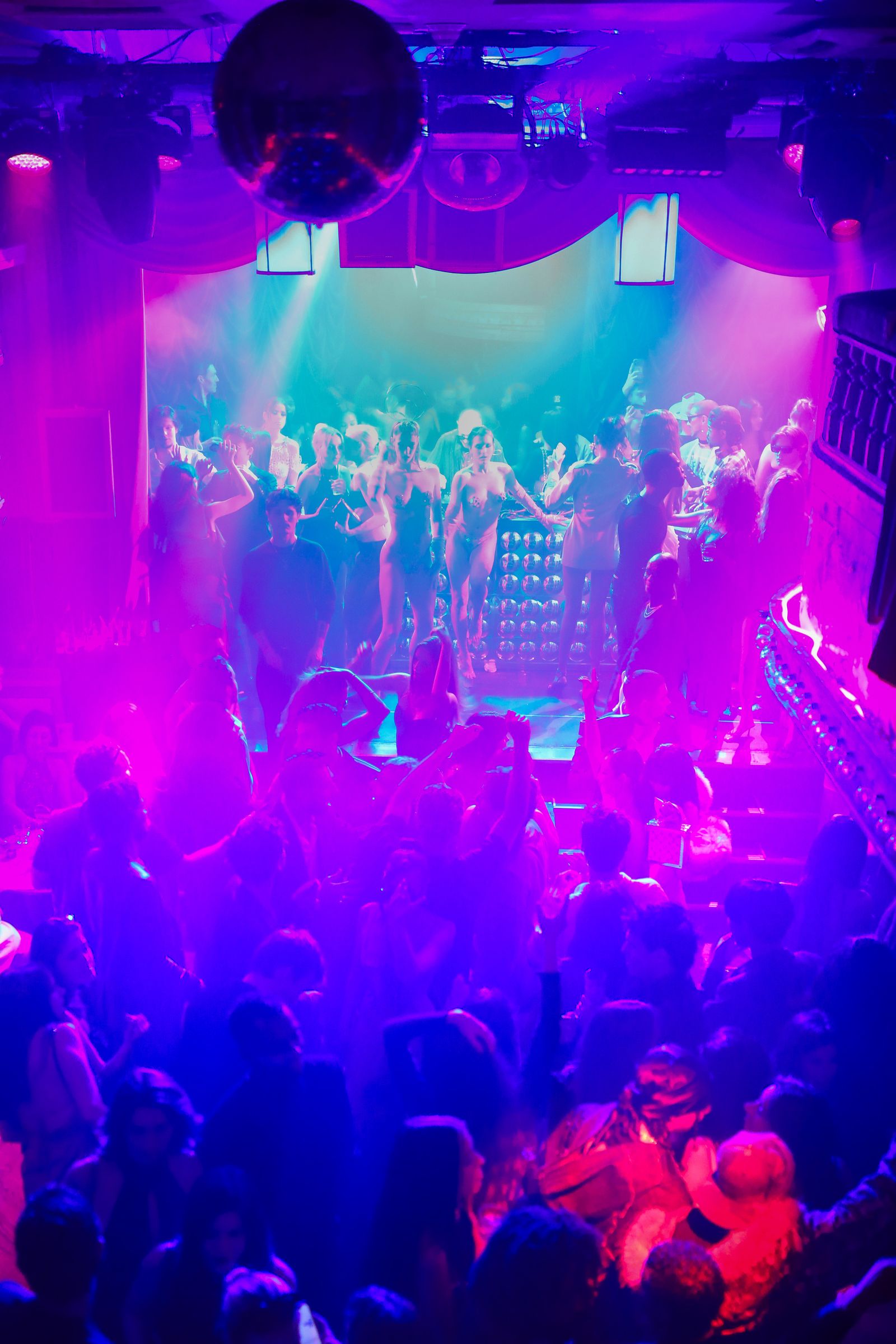 Image may contain Urban Night Life Club adults and people