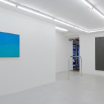 Artwork on display in white wall art gallery