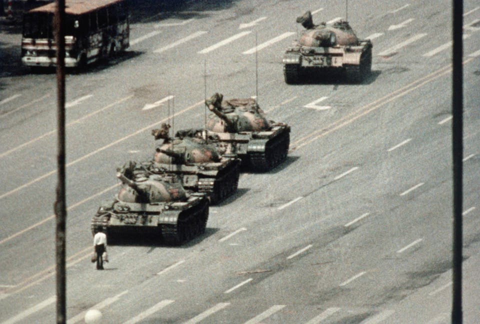 Protesters block tanks approaching Tiananmen Square